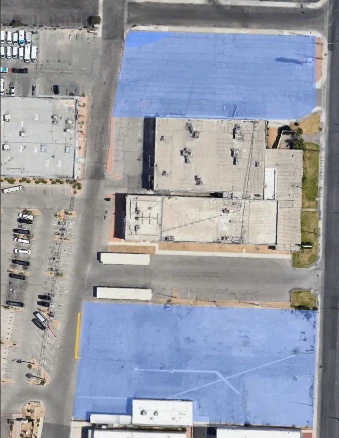 Aerial view of the paved Convention Center Yard lots — secured truck, trailer and tradeshow freight parking near the Las Vegas Convention Center