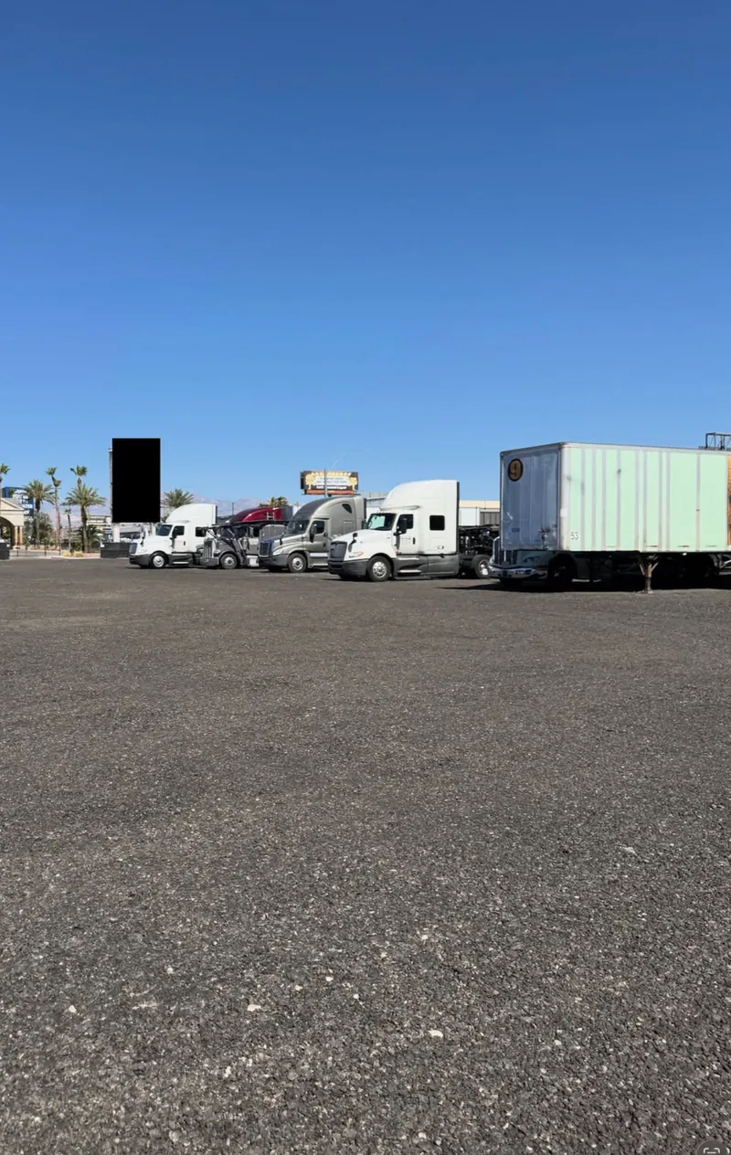 Wide-open graded gravel with room for semis and trailers at the Strip Yard truck storage lot in Las Vegas